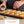 Cook N' Cool Perfect Baking Tray And SILPAT Baking Mat with Human Hands Sprinkling Cinnamon On Macarons