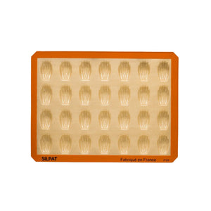Mini shell-shaped cakes displayed on a tray from Silpat mold