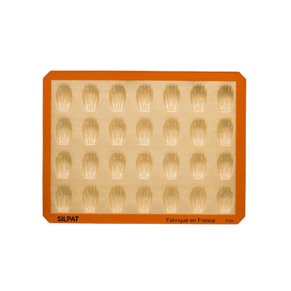 Mini shell-shaped cakes displayed on a tray from Silpat mold