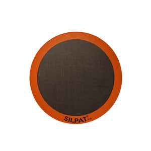 Silpat 12 inch round pizza mat on a baking tray
