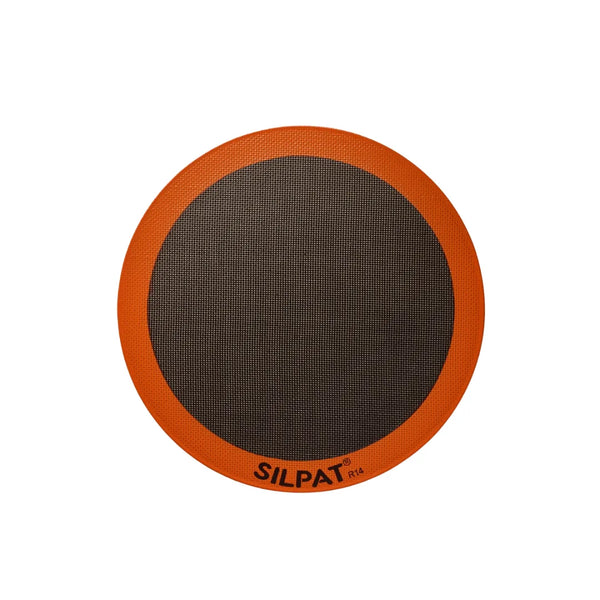 Silpat 12 inch round pizza mat on a baking tray