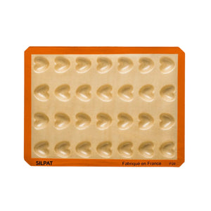 Finished mini heart-shaped treats released cleanly from Silpat mold