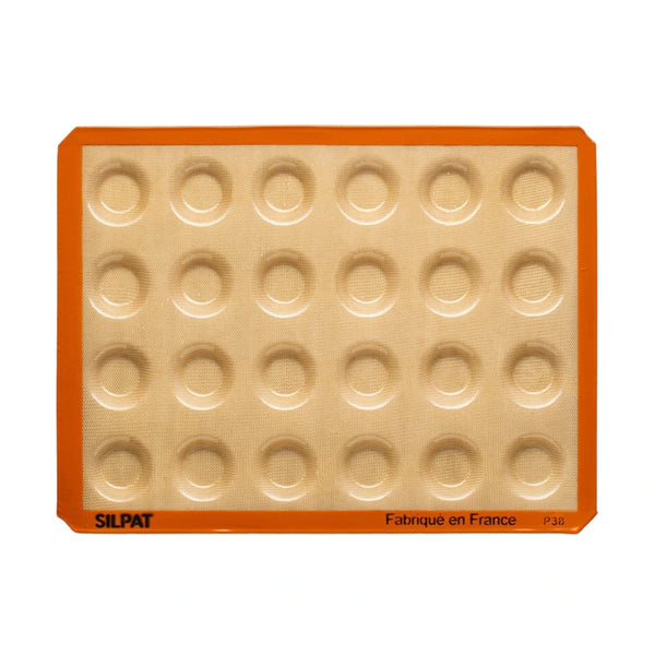 Silpat Mini Tartelette Mold on a baking tray with ready-to-fill crusts