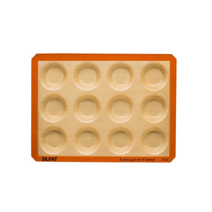 Golden mini tarts freshly baked in Silpat mold